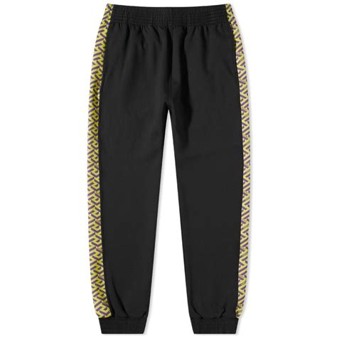 versace purple pants|Versace track pants.